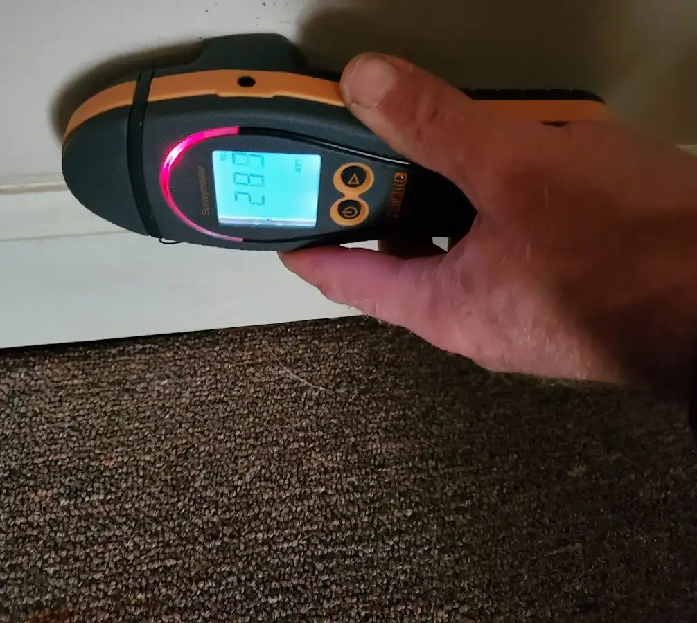 Moisture detection at baseboard during Burst Pipe Cleanup in Oxford
